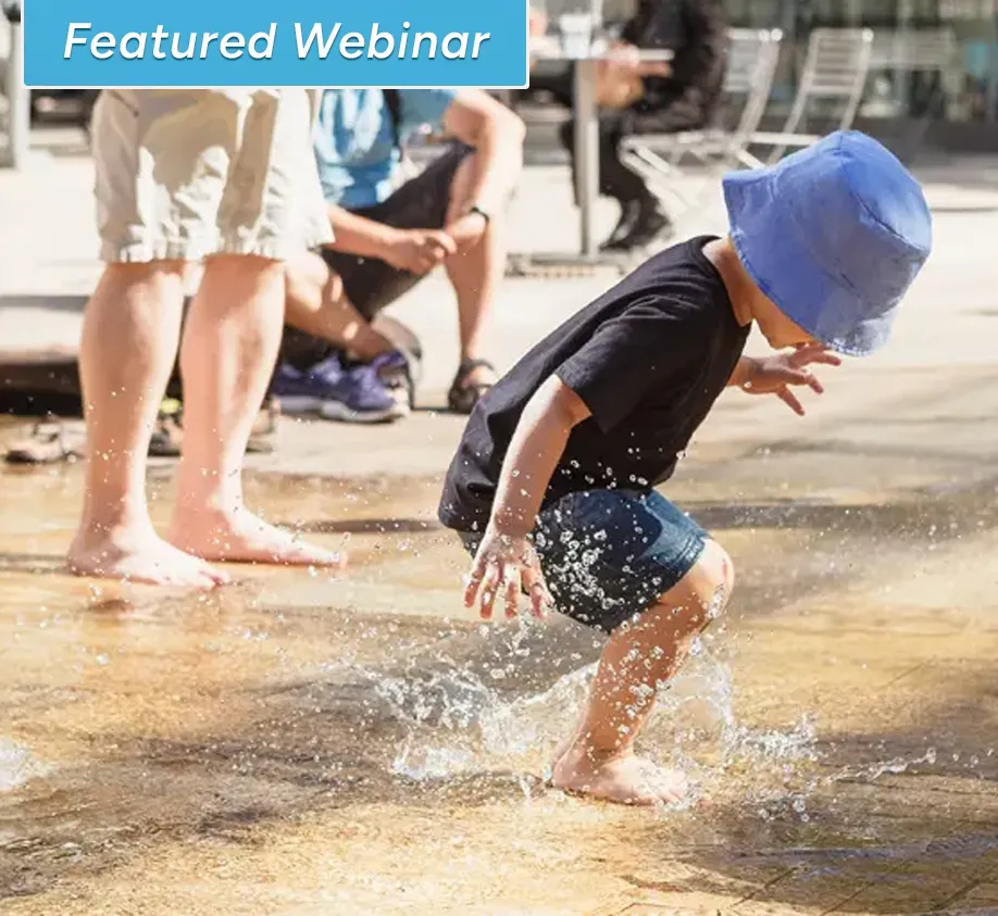 child playing in splash pad