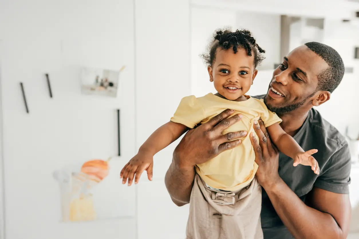 dad holding child
