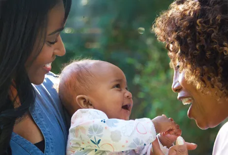caregivers with child outside